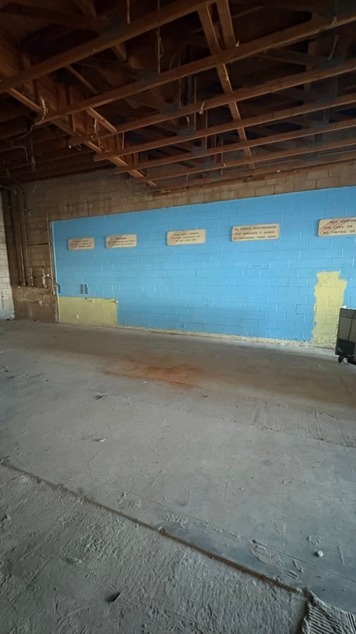 After â€” Commercial unit â€” fixtures pulled and swept